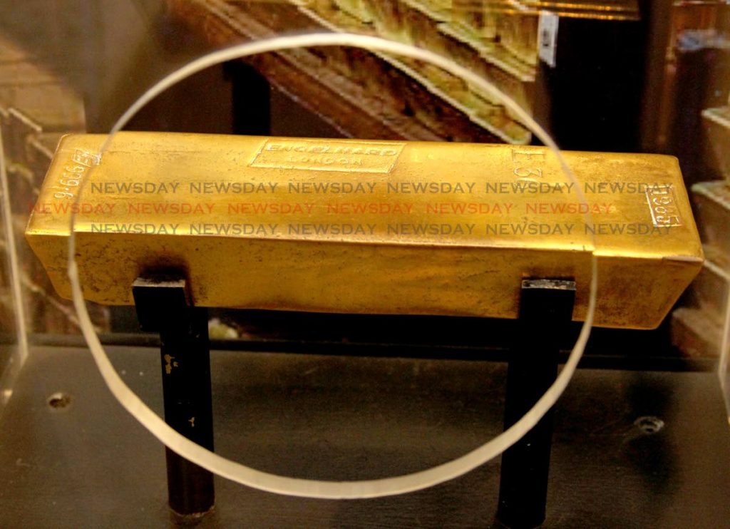 WORTH ITS WEIGHT: A bar of pure gold was one of the major attractons at the reopening on Tuesday of the Central Bank Museum. PHOTO BY ROGER JACOB