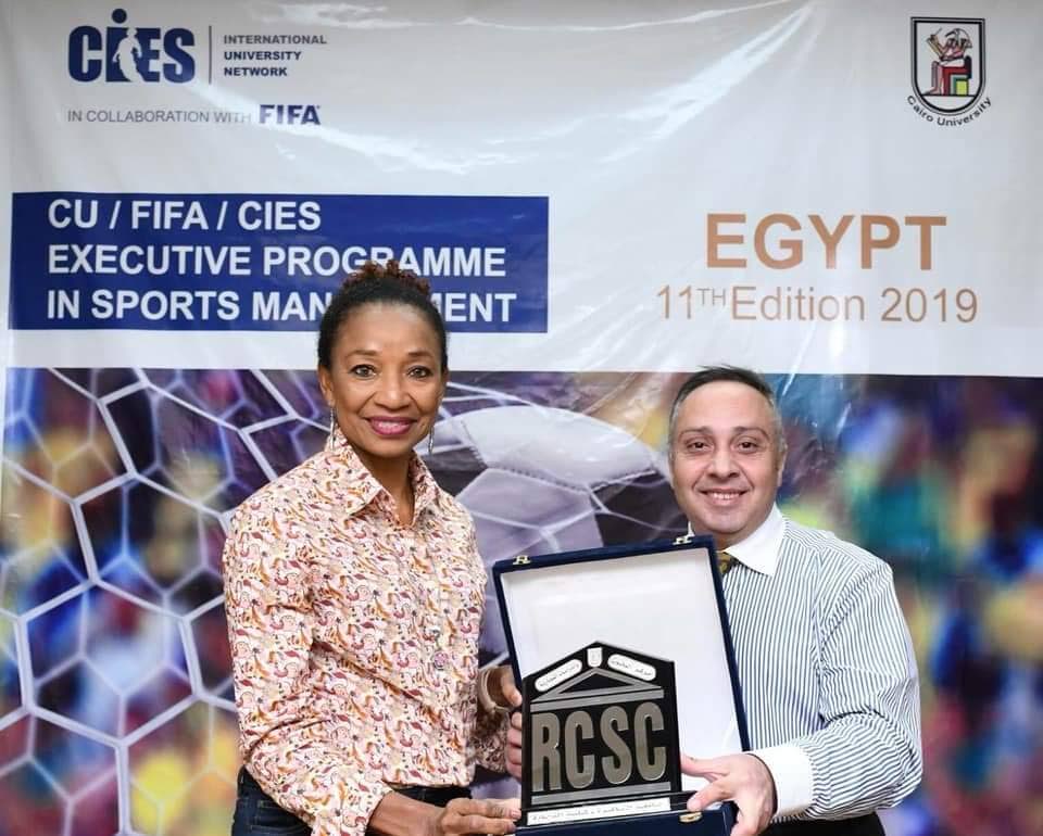 University of the West Indies lecturer and ex-national hockey player Sherlan Cabralis,left, and CU/FIFA/CIES coordinator Ayman Sabry display an award at the  CU/FIFA/CIES's executive programme in sports management, on Tuesday, in Cairo,Egypt.