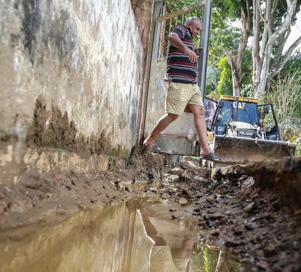 Diego Martin resident, Patrick Maharaj, leaps over an open trench to leave his house.  He is upset over the drain being built without any consultation from the MOWT Drainage Division being held with the residents of Surprise Lane, Diego Martin.

Jeff K. Mayers
