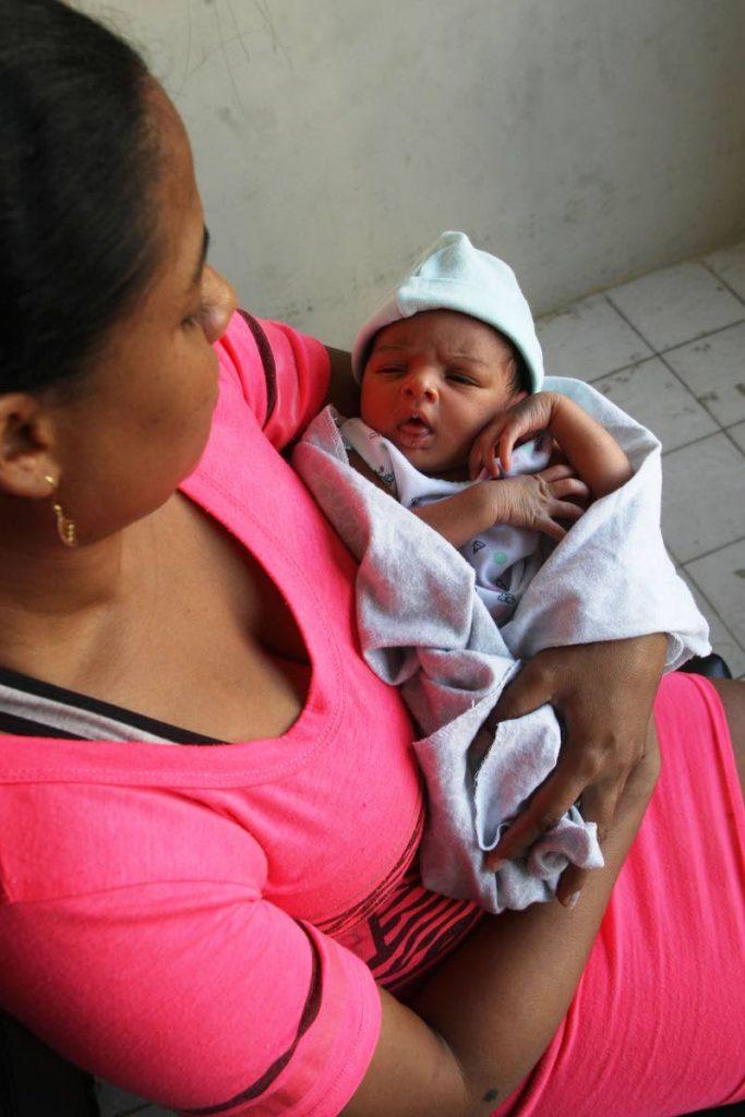 Simone Chadee and her baby, Athena, who was born in a car before Chadee could arrive at San Fernando General Hospital on January 18. PHOTO BY LINCOLN HOLDER