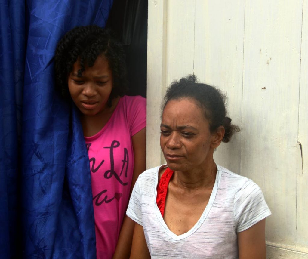 PLEASE COME HOME: Shantay Shallow, 14, and her mother Shondel at their home in Claxton Bay yesterday where they both pleaded for missing relative Shindlar Cuffy to be returned to them. PHOTO BY ANSEL JEBODH