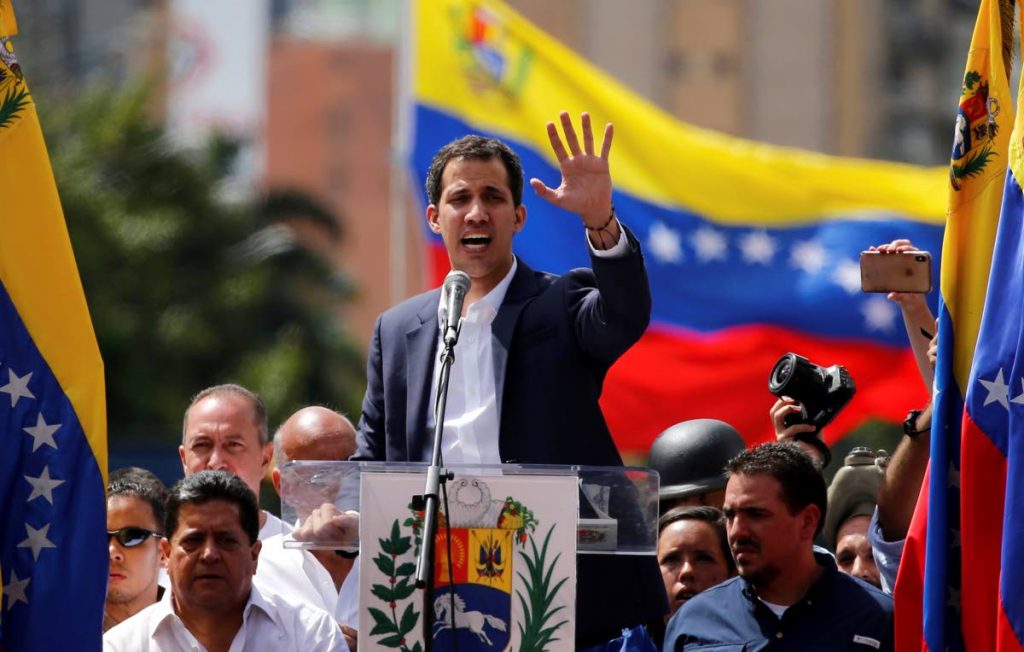 Juan Guaido, head of Venezuela’s opposition-run congress, speaks to supporters at a rally Wednesday when he declared himself interim President until new elections can be called (AP)