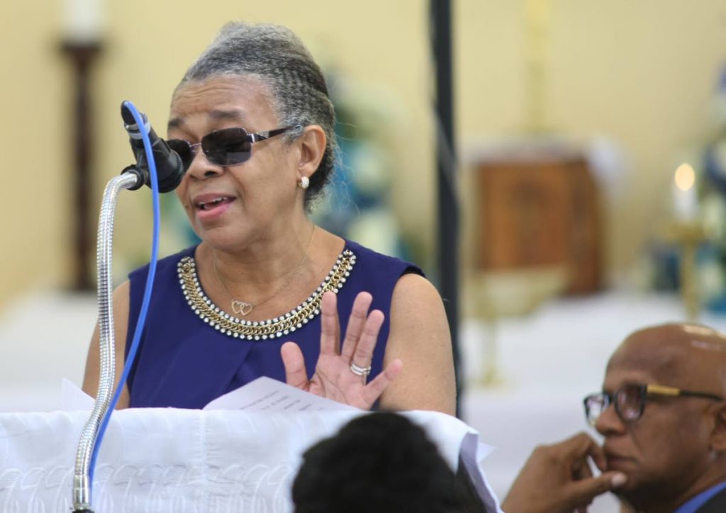 MY HUSBAND: Francisca Farmer-St George, wife of veteran masman Roland St George, delivers the eulogy at his funeral at the St Clement Anglican Church yesterday.  PHOTO BY LINCOLN HOLDER