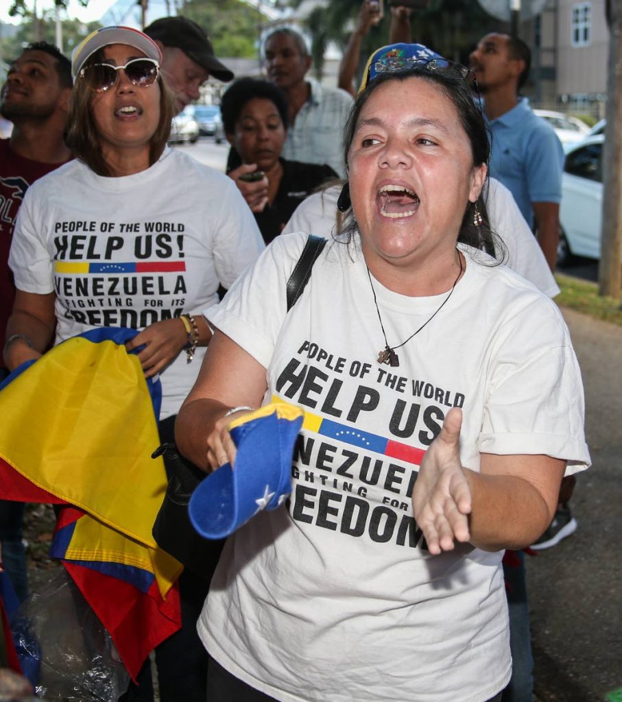 LIBERTAD: Venezuelan Ruth Albornoz chants as she and other Venezuelans assembled in the Queen’s Park Savannah in Port of Spain on Friday in support of National Assembly president Juan Guaido declaring himself President of Venezuela. PHOTO BY JEFF MAYERS