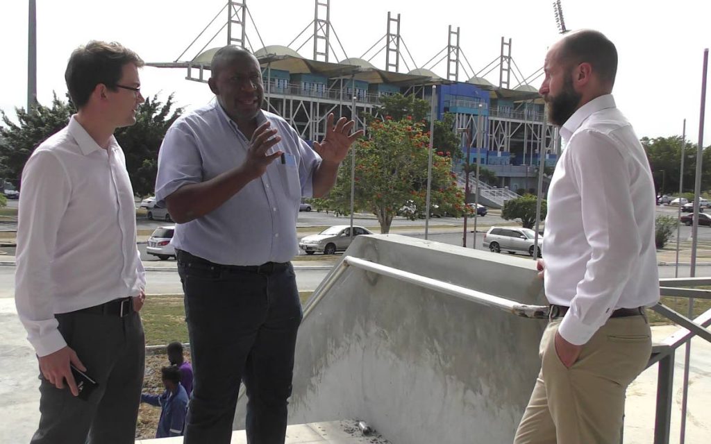 TT Football Association president David John-Williams, centre, chats with two UEFA officials about the progress of the Home of Football project. PHOTO BY TTFA MEDIA 