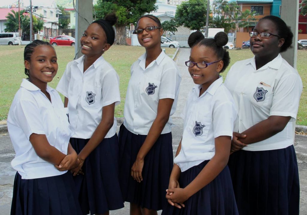 KINDNESS CREW: (L-R) Britney Woods, Rene Rampersad, Jurshelle Andrews, Chelsea Jacob and Tia-Marie Dellamore, students of Woodbrook Secondary School who hosted a “birthday party” on Tuesday for a homeless man regularly seen near their school. Photo by Roger Jacob