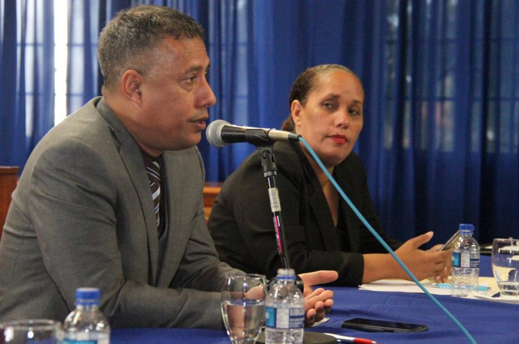 Arima Mayor Lisa Morris-Julian listens as Police Commissioner Gary Griffith addresses a meeting of the Arima Business Association, Arima Town Hall on Friday.