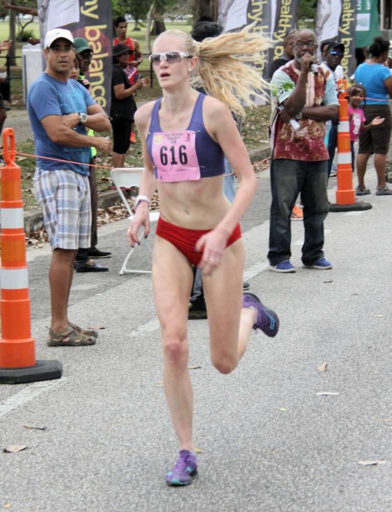 Jade Williams of Wales wins the women’s category in the KISS 5K event at the Queen’s Park Savannah, yesterday.