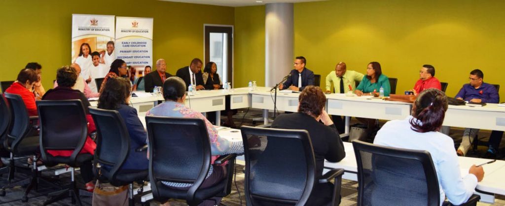 Education Minister Anthony Garcia, centre at right, and ministry officials in a meeting with a TTUTA delegation, including president Lynsley Doodhai, at the ministry in Port of Spain on Friday. PHOTO COURTESY EDUCATION MINISTRY