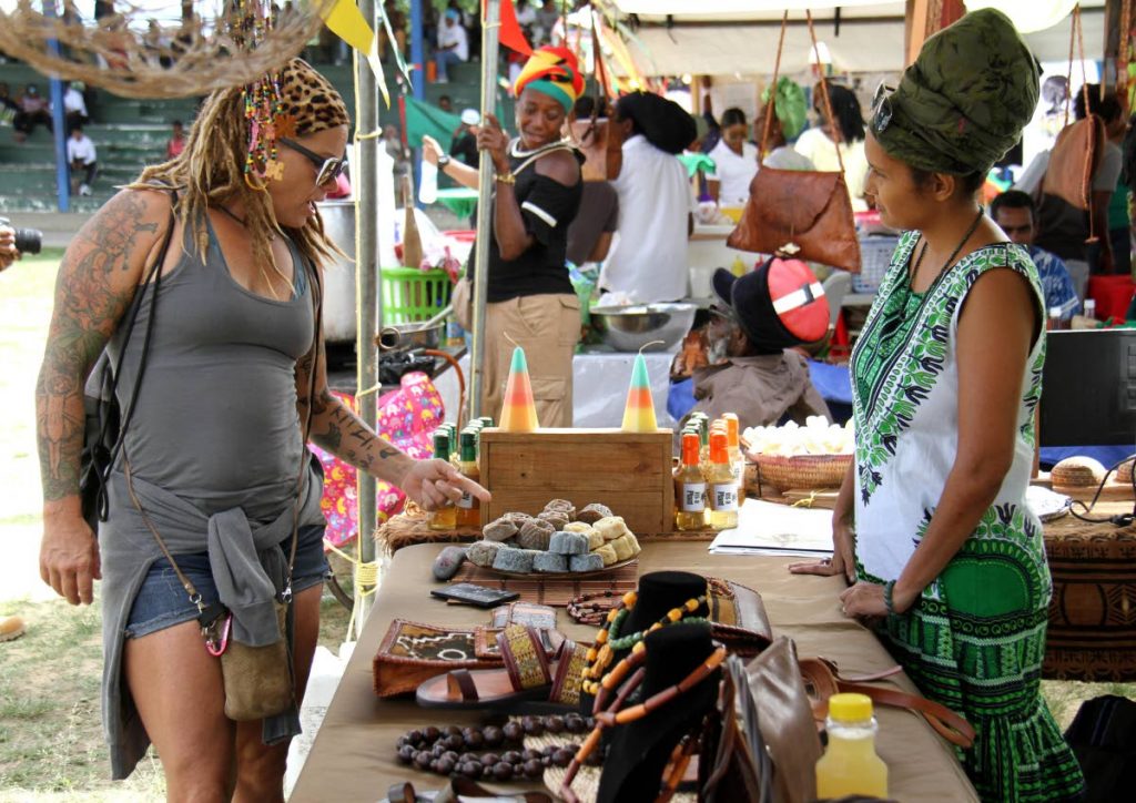 Canadian Coco Kissack checks out a booth with handmade merchandise at Skinner Park during the National Cannabis Rally II yesterday.