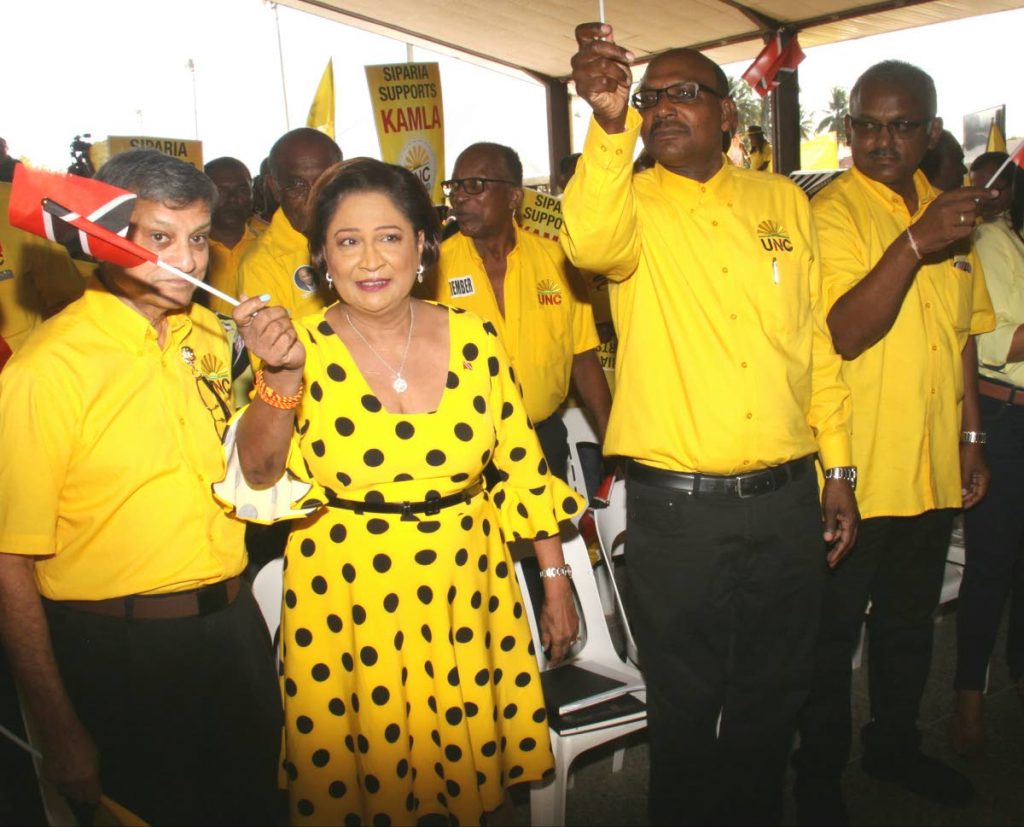 United National Congress Political Leader Kamla Persad-Bissessar, second from left, arrives at the party’s national assembly, Couva South Hall, Couva, last month. She is accompanied by, from left, her husband Dr Gregory Bissessar, Opposition senator Wade Mark and Opposition MP for Couva South Rudranath Indarsing.