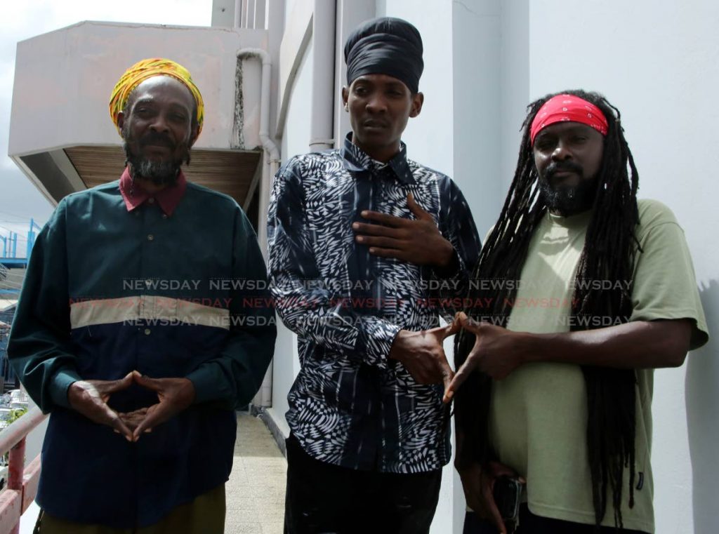  Makaan Grant center ,  son of Eric Grant left ,who was charged for having Cannabis, at the All Mansion of Rastafari Rally held at Skinners Park,  San Fernando last Sunday. He was given 80 hours,  Community Service by San Fernando Magistrate  Alicia Chanka  when he appeared in court this morning.   They were  being accompanied by a representative of the AMOR Ronald Sammy after the Court hearing . Photo by Vashti Singh 28-1-19