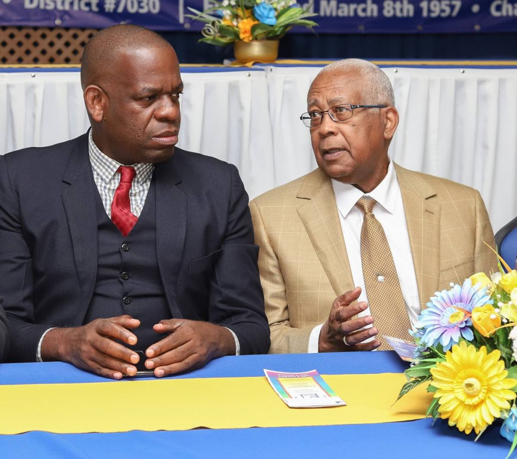 EDUCATED MEN: Education Minister Anthony Garcia, right, and Minister in the Education Ministry Lovell Francis during their visit yesterday to the Goodwill Industries Special School in Woodbrook. PHOTO BY JEFF MAYERS