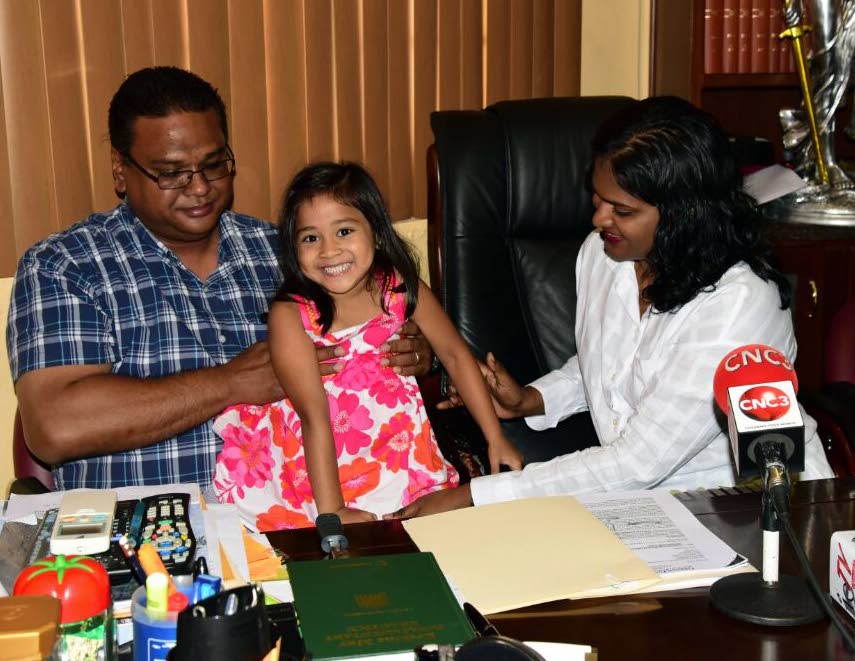 Then three-year-old Shannen Luke with her parents at the law chambers of Gerald Ramdeen in April 2017 as they appealed to the Children's Life Fund for help with Luke's medical bills. FILE PHOTO