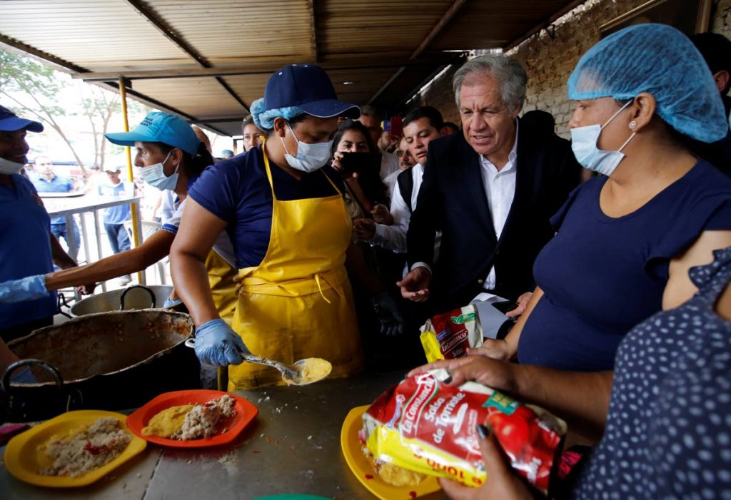 Organisation of American States Secretary General Luis Almagro talks to Venezuelan migrants at the Divina Providencia migrant shelter, in La Parada, Colombia on September 14, 2018. FILE PHOTO
