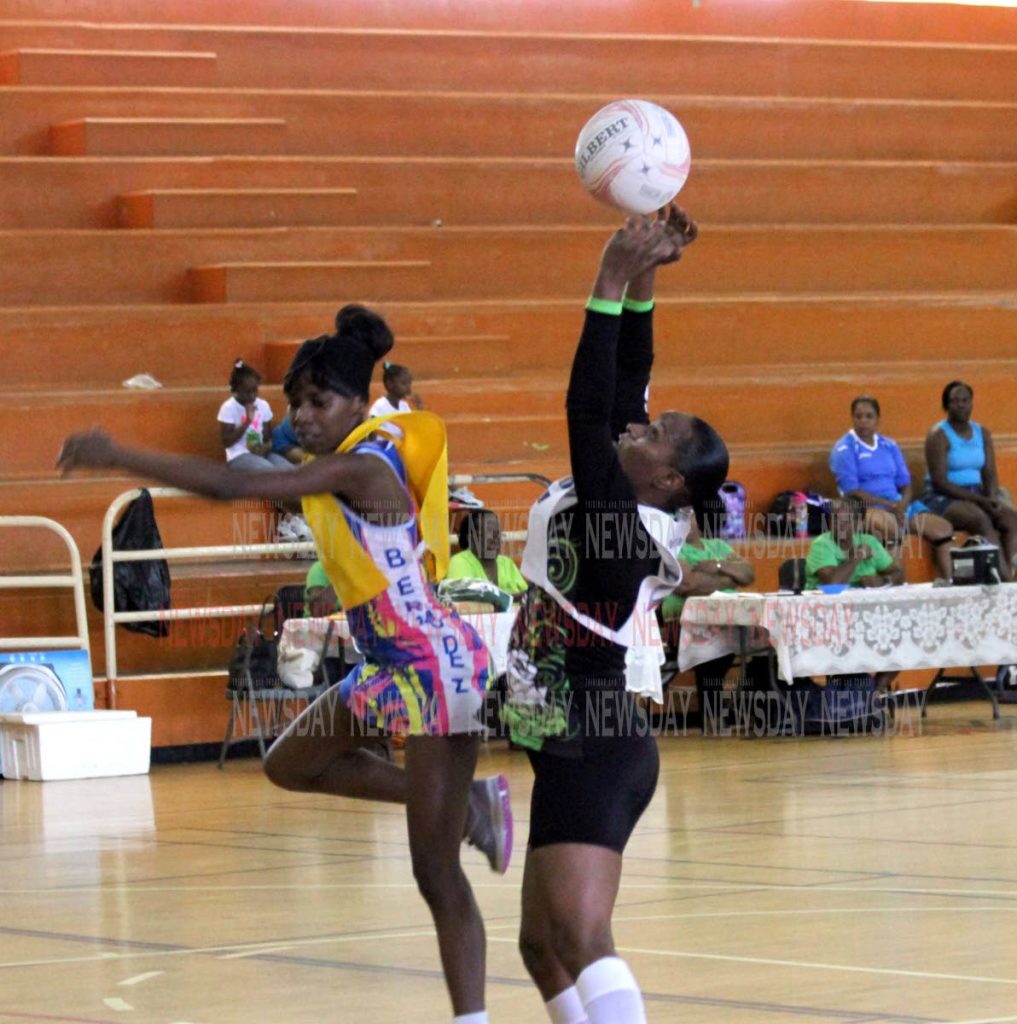 TSTT's Melissa Stephenson, right, catches the ball against Bermudez in a Courts All Sectors Netball League championship division match last month. Photo by Sureash Cholai