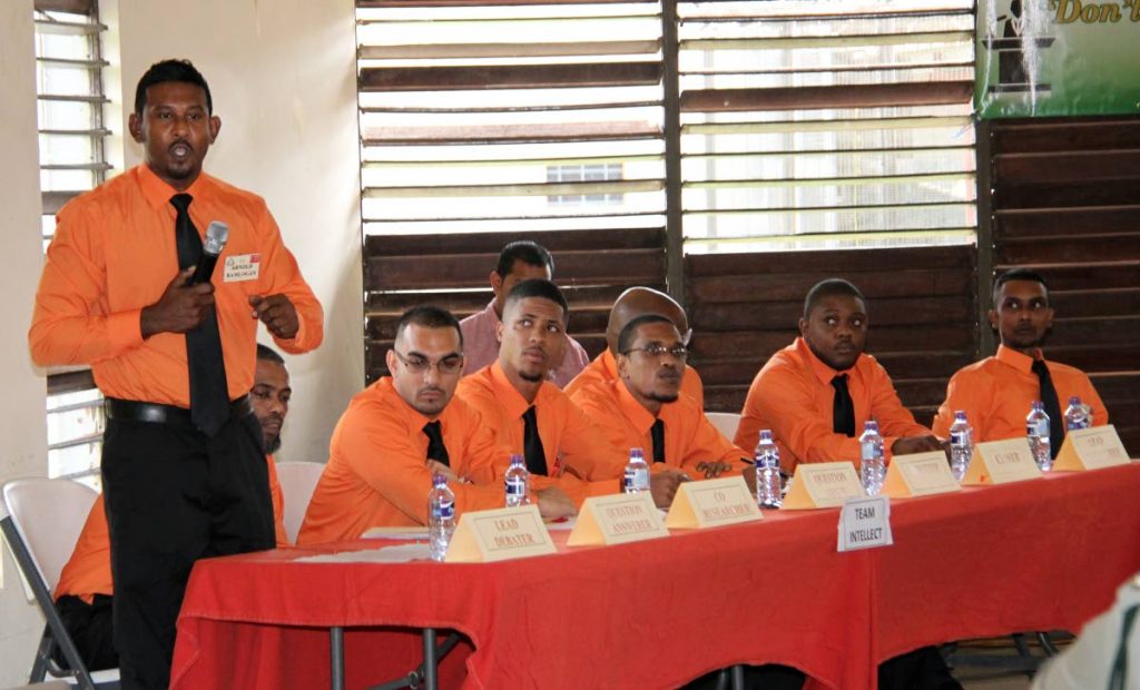 Arnold Ramlogan far left the lead debater for prison inmates debate team, Team Intellect, in the prisons debate finals held at the Maximum Security Prison in Arouca.