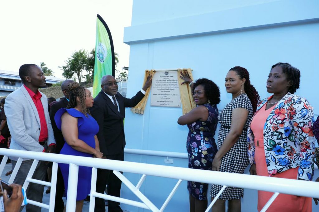 Tobago East MP Ayanna Webster-Roy, second from right, and Chief Secretary Kelvin Charles, third from left, participate in the commissioning of the new Belle Garden Multipurpose Facility on Tuesday. Others in photo from left are Assemblyman Ancil Dennis, Community Development Officer Michelle Burris, Secretary of the Division of Community Development Marslyn Melville-Jack, and Community Development Administrator Cherryl-Ann Solomon.