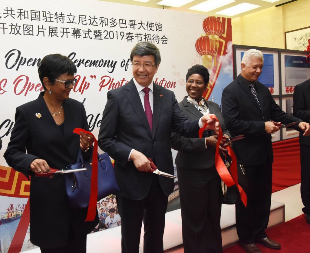 Senate president Christine Kangaloo, left, Chinese Ambassador Song Yumin, Speaker Brigid Annisette-George and Port of Spain Mayor Joel Martinez, right, cut the ribbon to open the Chinese art exhibition at the Chinese Embassy, Long Circular Road, Maraval, last Thursday. PHOTO BY KERWIN PIERRE