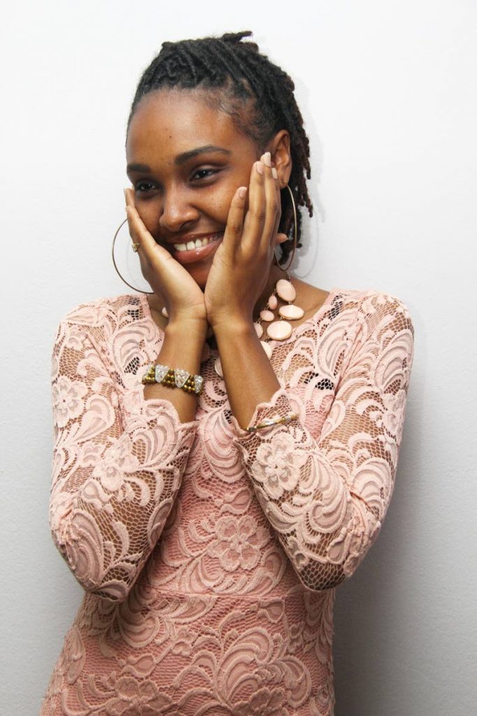 Genelle Bharat shares a light moment with photographers at Newsday’s Pembroke Street office.