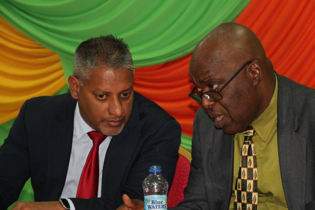 Chief Secretary Kelvin Charles, right, speaks with Agriculture Minister Clarence Rambharath at the Tobago launch of the incentive programme - the National Agricultural Finance Support Programme (Agro-Incentive) last Wednesday at the Division of Community Development, Glen Road Scarborough.