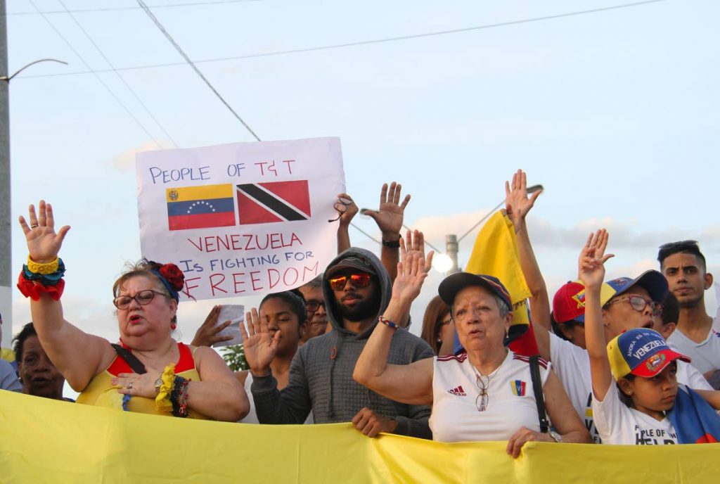 Venezuelans show their support for Juan Guaido as interim president during a rally at Queen's Park Savannah, Port of Spain. PHOTO BY AYANNA KINSALE