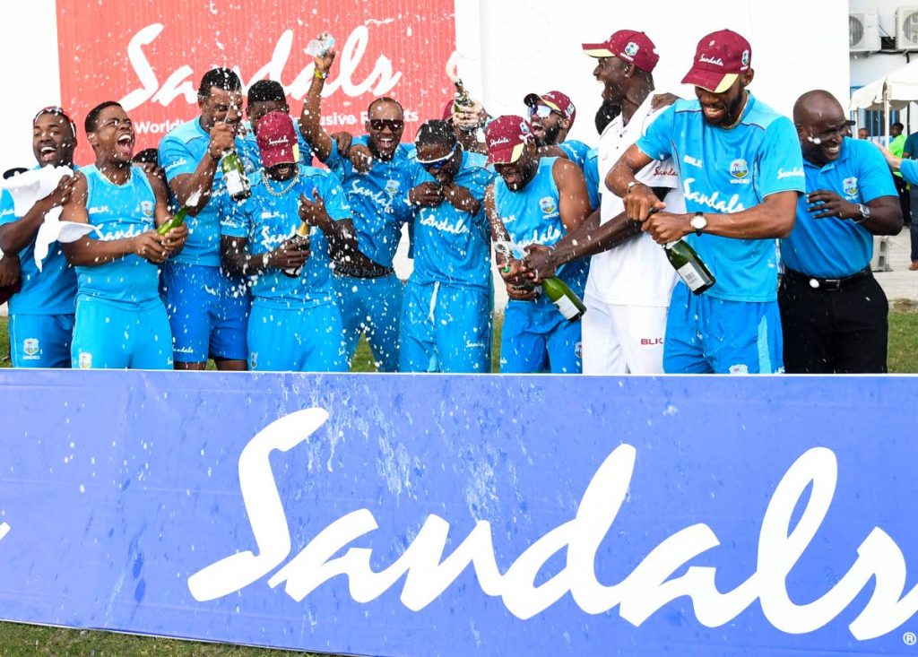 West Indies players celebrate their Test series victory over England on Saturday at the Sir Vivian Richards Stadium in Antigua.