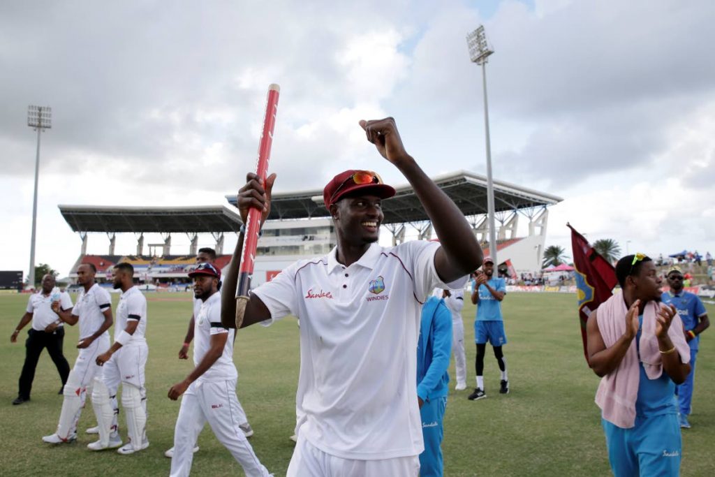 West Indies' captain Jason Holder celebrates beating England by ten wickets on day three of the second Test at the Sir Vivian Richards Stadium in North Sound, Antigua, Saturday.