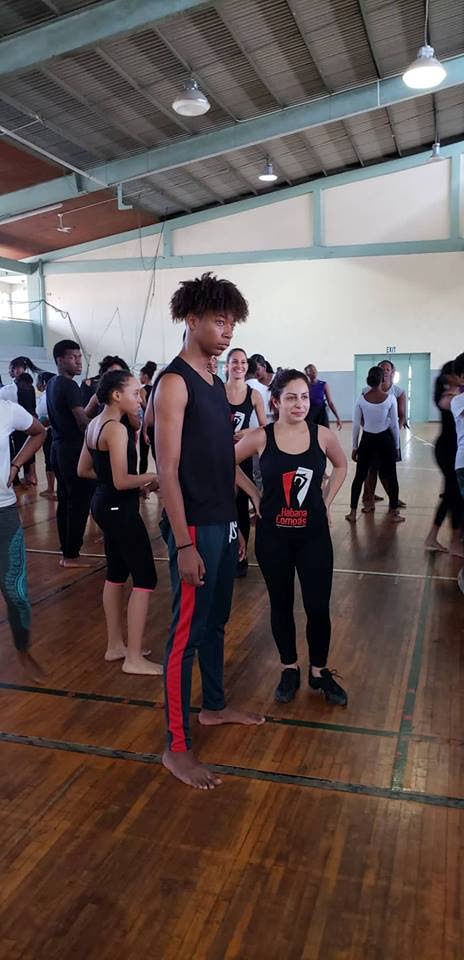 Jaden Forde partners with a Habanas Compas dancer to learn how to salsa. 