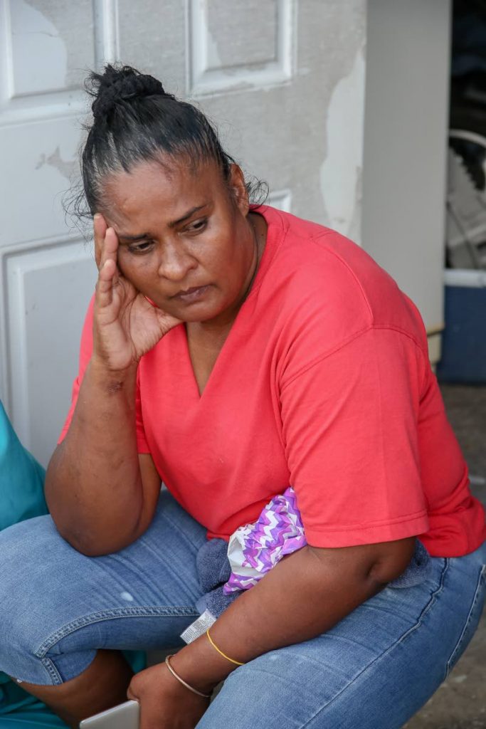 Doreen Allan, mother of slain Muhammad 
Allan, remembers her last moments with her son at her home on Circular Drive, Crown Trace, 
Chaguanas, 
yesterday. PHOTO BY JEFF K. MAYERS