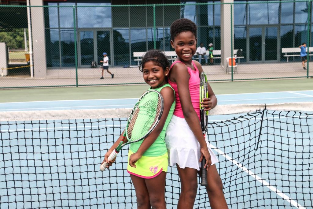 Naomi Mohammed, left, and Tianna Richardson have been playing lawn tennis since they were three. PHOTOS BY RIHANNA McKENZIE