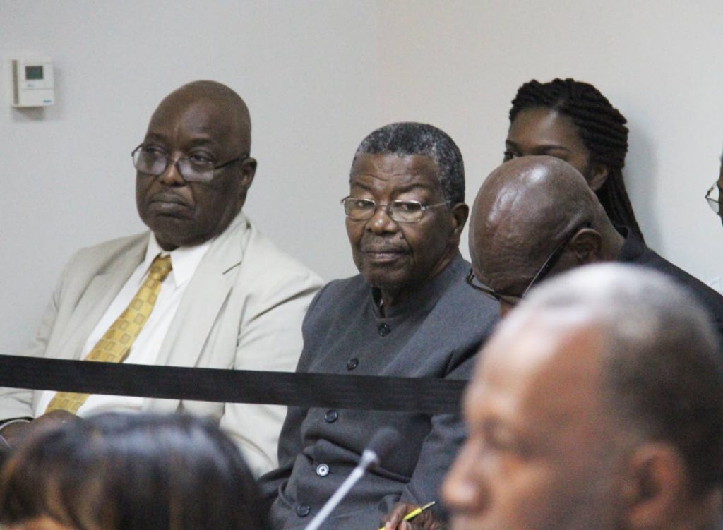 File photo: Kelvin Charles and  Hochoy Charles, centre.