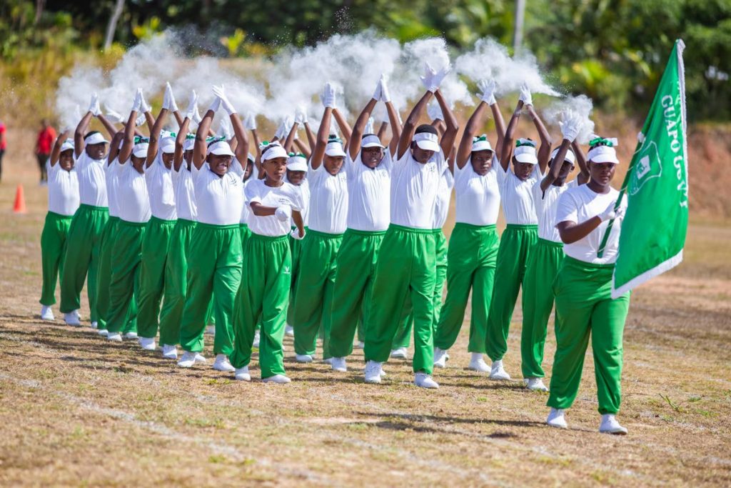 CHAMPIONS: Guapo Government shows off their winning routine in the march past at the La Brea Zonal Primary Schools Games on Thursday at Sobo Recreation Ground, La Brea. PHOTO COURTESY NATIONAL ENERGY 