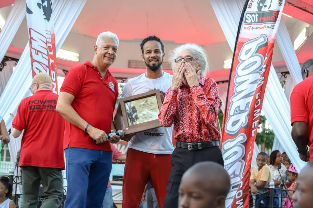 Music Legend Roy Cape blows a kiss to as Soca artist Kees Dieffenthaller was honoured by Port of Spain Mayor Joel Martinez at the Launch of Downtown Carnival, Woodford Square, Port of Spain yesterday. PHOTO BY JEFF MAYERS