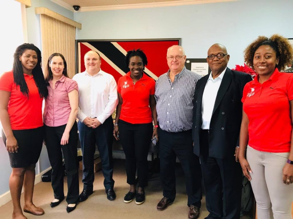 TT's Commonwealth Youth Games 2021 bid team Rheeza Grant, left, Kwanieze John, centre, and Chanelle Young, right, with members of the Commonwealth Games Federation evaluating committee in Trinidad earlier this week. 