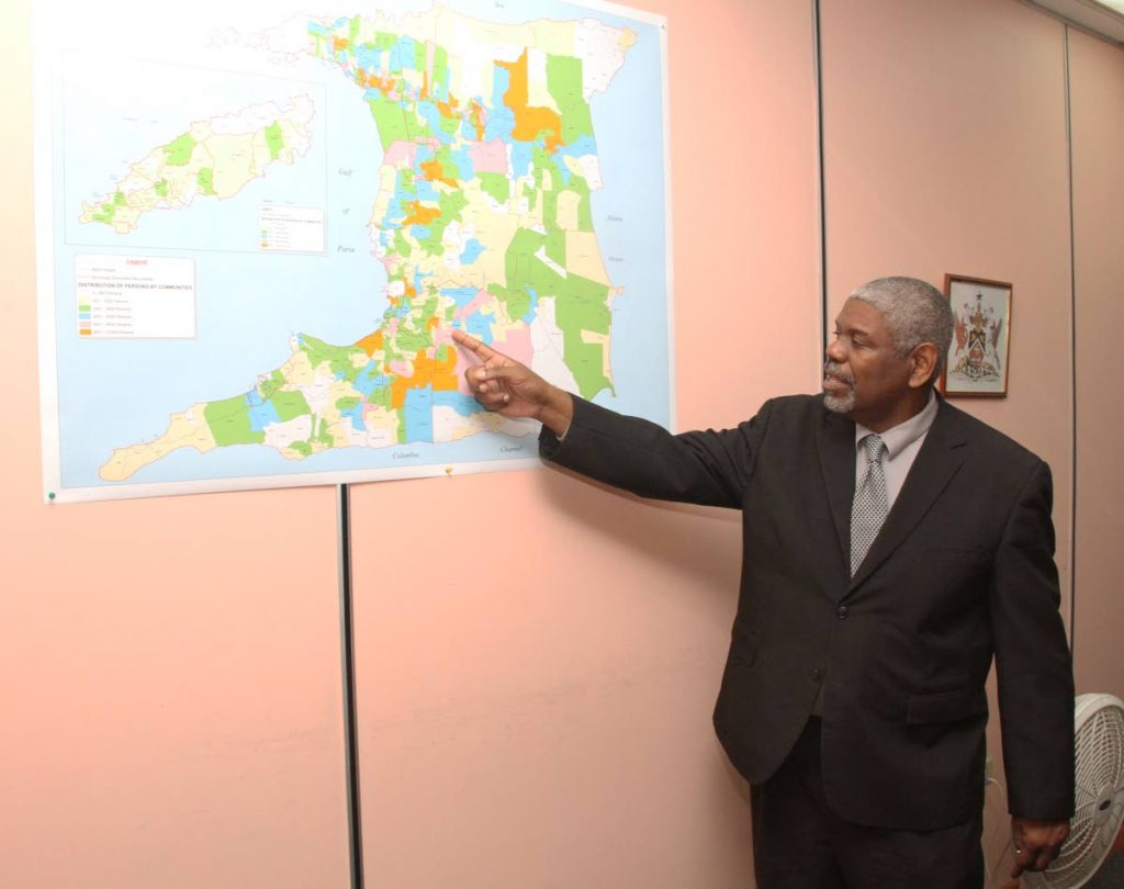Director of Statistics, Sean O'Brien points to a map of Trinidad and Tobago at his Central Statistics Office (CSO) Duke Park Street, Port-of-Spain. Photo by Ayanna Kinsale