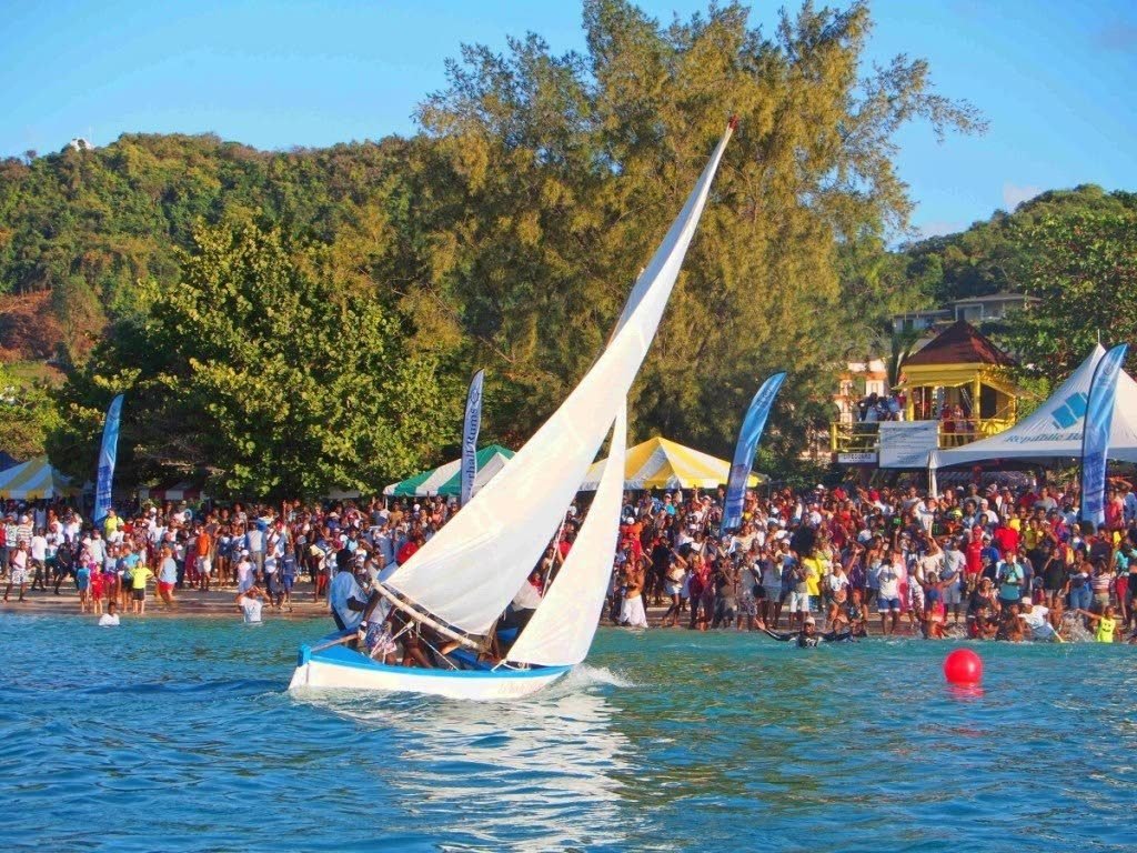 Ah Doh Know sails to victory before a huge crowd at the Grand Anse Beach, during the Grenada Sailing Festival Workboat Regatta.