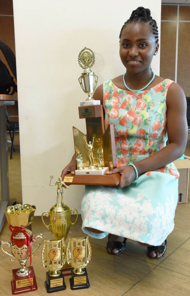 Chequeda De Boulet poses with her trophies for the Junior and Senior Female of the Year, at the TT Badminton Association’s awards ceremony,on Saturday, at the National Racquet Centre, Tacarigua. PHOTOS BY KERWIN PIERRE