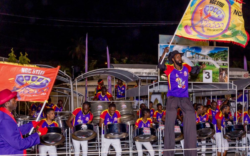 Moko jumbies dance to the music of NGC Steel Xplosion as pannists perform before the judges for the preliminary round of Panorama at its Buccoo base.