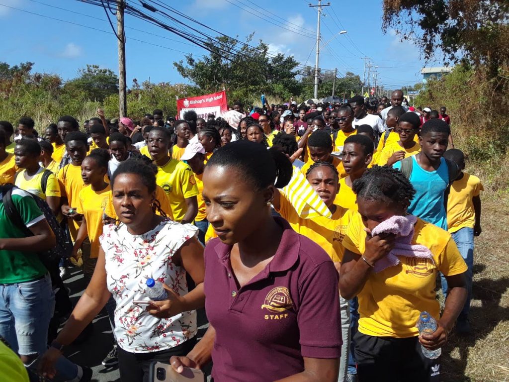 Students march on to Gulf City mall in Lowlands on Tuesday for am anti-bullying gathering organised by the Tobago Association of Student Councils.