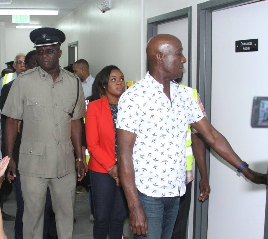 Prime Minister Dr Keith Rowley, in front, tours the Shirvan Road Police Station on Monday afternoon along with MP for Tobago West, Sports Minister Shamfa Cudjoe, and Senior Superintendent Jeffrey George.