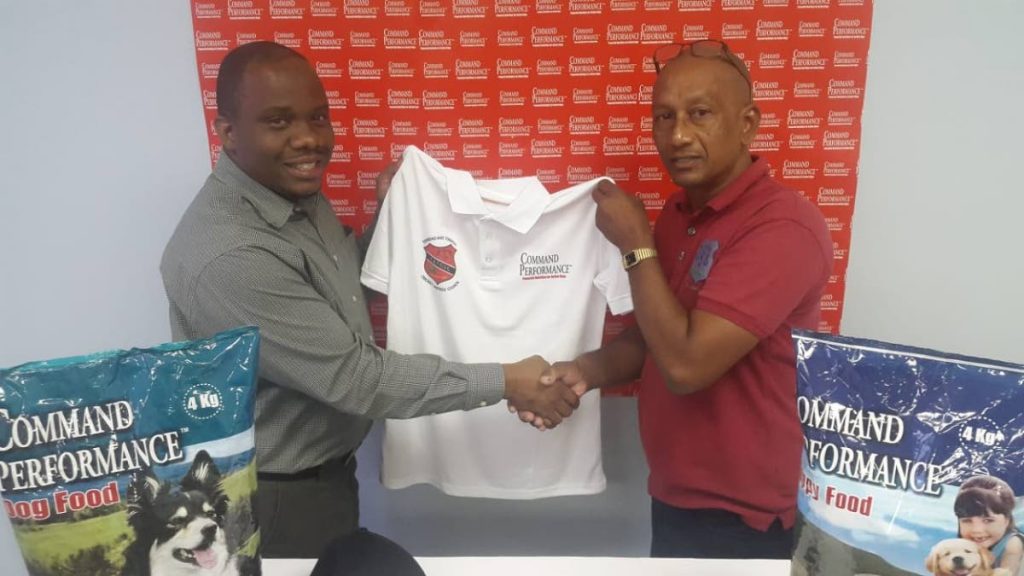 Brand Manager of National Flour Mills Kevon Fields, left, presents  president of the TT Umpires and Scorers’ Council Parasram Singh with a Command Performance sponsorship package to outfit officials for the 2019 TTCB cricket season. PHOTO COURTESY TTCB 
