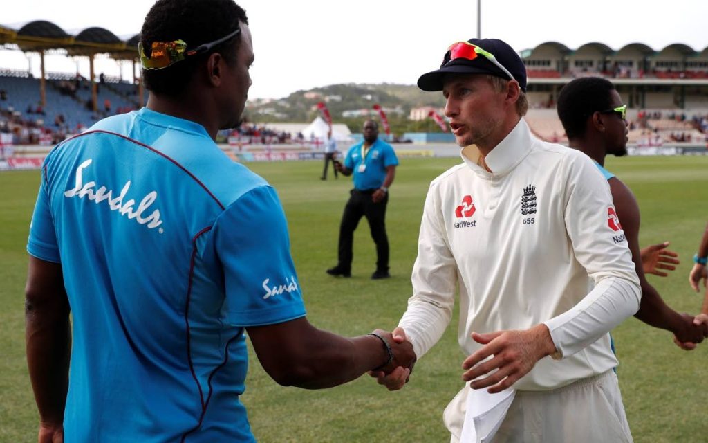 Windies pacer Shannon Gabriel, left, shakes the hand of England captain Joe Root after the 3rd Test in St Lucia recently. 