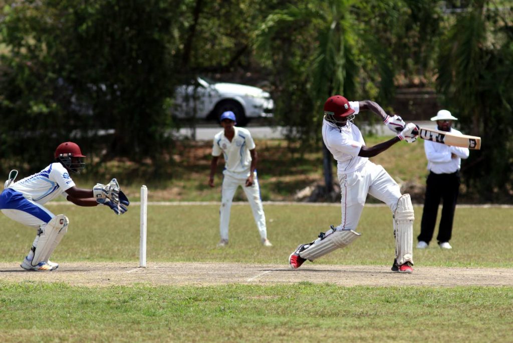St Benedict’s Joshua James on the attack against Naprima College in the Powergen Secondary Schools Cricket League yesterday at Lewis Street, San Fernando.