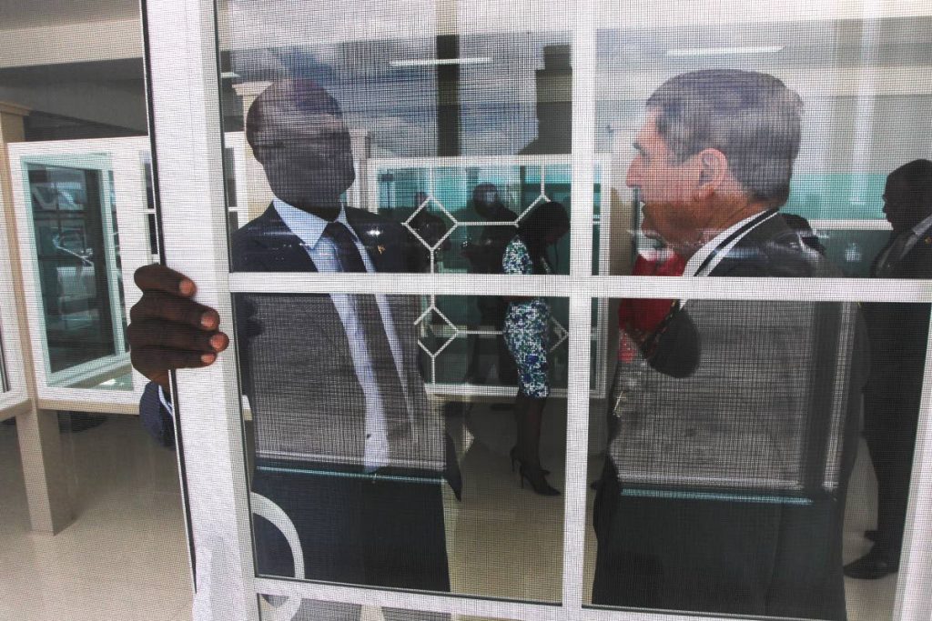Prime Minister Dr Keith Rowley chatting with CEO of Domus Caribbean uPVC Solutions, Terrence Ortt following the official launch of the faciility at Factory Road, Chaguanas. Photo by Lincoln Holder