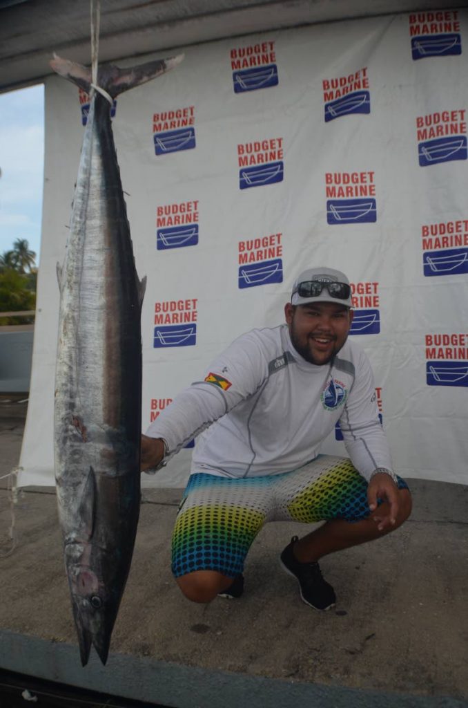 BEST ANGLER: Joshua Camacho of Team Bless with his 31-pound wahoo caught over the weekend. PHOTO BY RONALD DANIEL 
