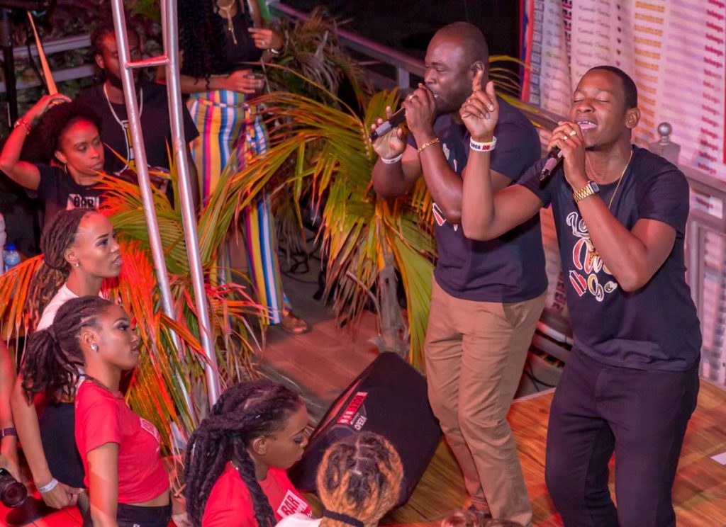 Jason George, left, and Darren Thomas perform their hit song, Come Leh We Go, at the I Love Soca event hosted by Barcode on 
Milford Road, Scarborough, on Tuesday.   PHOTO BY DAVID REID