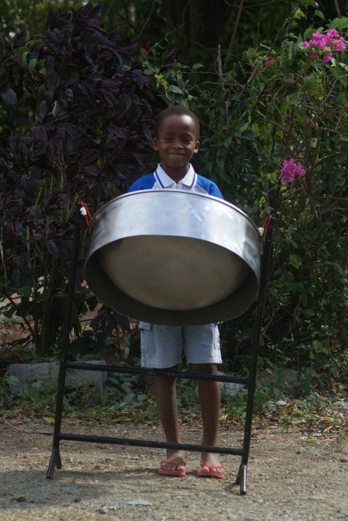 Seven-year-old Foluke Virgil is not much taller than his steelpan but is fast mastering the instrument. PHOTOS BY ELSPETH DUNCAN