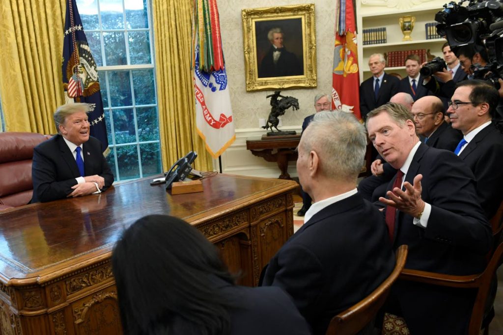 TRADE TENSIONS: US President Donald Trump, left, and US Trade Representative Robert Lighthizer, second from right, talk with Chinese Vice Premier Liu He, second from left, during their meeting in the Oval Office of the White House in Washington last Friday. 