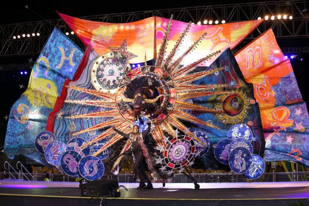 MAS MAS: Nigel Baptiste portrays his costume Taurus Raging Through the Fields of the Universe during the King of Carnival preliminaries at the Queen’s Park Savannah on Thursday.